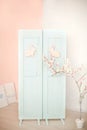 Easter. Blue door with easter bunny. Decorations on the door with Easter bunny. Rustic interior element of the spring porch. Easte Royalty Free Stock Photo