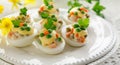 Easter boiled eggs stuffed with vegetable salad with mayonnaise served on a white plate