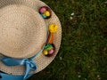 Easter bonnet straw hat decorated with eggs and flowers Royalty Free Stock Photo