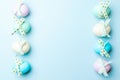 Easter border. Colorful egg with tape ribbon on pastel blue background in Happy Easter decoration. Flat lay, top view