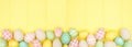Easter bottom border with modern farmhouse cloth and pastel eggs over a yellow wood banner background