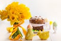 Easter bouquet of yellow daffodils and Easter cake. Royalty Free Stock Photo