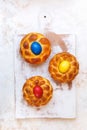 Easter bread with colored eggs on rustic  kitchen board Royalty Free Stock Photo