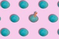 Easter break the pattern, blue eggs on a pink background while one hand comes out, creative easter design Royalty Free Stock Photo