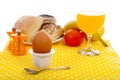 Easter breakfast with egg, bread, fruits and drinks Royalty Free Stock Photo
