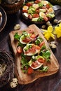 Easter breakfast with egg halves stuffed with ham and vegetables and fresh salad on rustic table Royalty Free Stock Photo