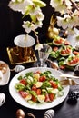 Easter breakfast with fresh salad and eggs on black table Royalty Free Stock Photo