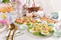 Easter breakfast with fresh salad stuffed eggs and traditional pastries Royalty Free Stock Photo