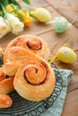 Easter breakfast Holliday concept. Easter bunny buns rolls with cinnamon made from yeast dough with orange glaze, easter