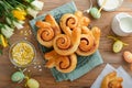 Easter breakfast Holliday concept. Easter bunny buns rolls with cinnamon made from yeast dough with orange glaze, easter