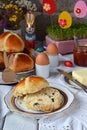 Easter breakfast with traditional hot cross buns, jam, butter and egg. Holiday still life. Festive table place setting decoration Royalty Free Stock Photo