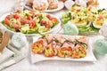 Easter breakfast with vegetable salad wrapped in ham, deviled eggs and fresh salad with prosciutto and lettuce Royalty Free Stock Photo