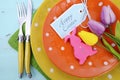 Easter bright color orange, yellow and green polka dot theme table place setting