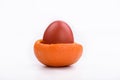 Easter bright egg in mandarin crust Royalty Free Stock Photo