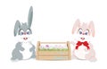 Easter bunnies and easter eggs in wooden box for decoration