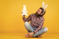 Easter Bunnies. spring holiday shopping advertisement. Human Easter Bunny on yellow background. man express positive