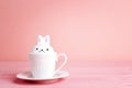 Easter bunnny-cup on a pink background. Royalty Free Stock Photo