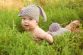 Easter bunny baby in green meadow. Royalty Free Stock Photo