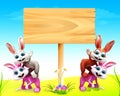 Easter bunny with big wooden signb