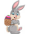 Easter Bunny carrying basket of easter egg Royalty Free Stock Photo