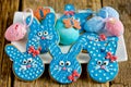 Easter bunny cookies, homemade painted gingerbread biscuits in glaze shaped funny rabbits for Easter