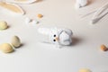 Easter bunny craft from plastic bottle. Kids DIY home activities. Handmade cute toy rabbit on table. Reuse concept Royalty Free Stock Photo