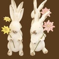 Easter bunny dance....four little rabbits holding flowers are in formation doing an Easter dance - isolated Royalty Free Stock Photo