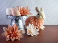Easter Bunny Decor sitting by a Raised Rustic Metal Dish Filled with String Decorated Easter Eggs