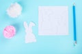 Easter bunny decoration paper cut background. DIY holiday handicraft garland of colorful rabbits and craft tools. Top