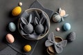 Easter Bunny ears from napkins and eggs. Quail and chicken eggs. Gray textile background. Happy easter