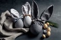 Easter Bunny ears from napkins and eggs. Quail and chicken eggs. Gray textile background. Happy easter