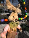 Easter bunny in front of an easter fountain Royalty Free Stock Photo
