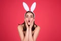 Easter bunny girl wear easter fluffy bunny ears hold easter eggs, isolated studio background. Eater portrait of female