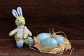 Easter Bunny Nest Duck Eggs on Rough Background Royalty Free Stock Photo