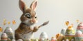 Easter bunny painting an egg, with various decorated eggs around it and plenty of white space for text Royalty Free Stock Photo