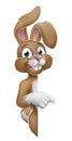 Easter Bunny Rabbit Pointing Cartoon at Sign Royalty Free Stock Photo