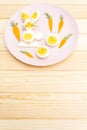 Easter bunny rabbit and chicken eggs children kids food concept. With carrot on rosy pink plate Royalty Free Stock Photo