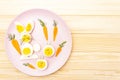 Easter bunny rabbit and chicken eggs children kids food concept. With carrot on rosy pink plate Royalty Free Stock Photo