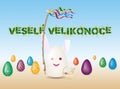 Easter Bunny with Easter symbols, pomlazka, painted eggs and eggnog.