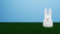 easter bunny shaped as an egg sitting in the gras. 3D rendering.