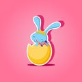 Easter Bunny sitting in golden egg with flowers Royalty Free Stock Photo