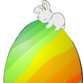 Easter bunny sleeping on an egg