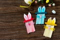 Easter bunny toy gift stics puppets on wooden table. Copy space. Handmade. Project of children`s creativity. Royalty Free Stock Photo