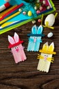 Easter bunny toy gift stics puppets on wooden table. Handmade. Project of children`s creativity, handicrafts. Royalty Free Stock Photo