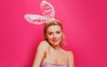 Easter bunny woman. Studio shot of a young woman wearing bunny ears.