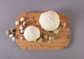 easter cake covered with white glaze quail eggs on a wooden cutting board top view. easter theme Royalty Free Stock Photo