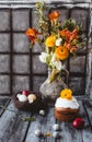 Easter cake with Easter eggs in nest and spring flowers in jug Royalty Free Stock Photo