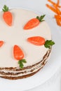 Easter cake with little carrots on white dish