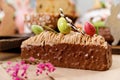 Easter cake orthodox sweet bread kulich and colorful chocolate eggs on festive table Royalty Free Stock Photo