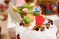 Easter cake orthodox sweet bread kulich and colorful chocolate eggs on festive table Royalty Free Stock Photo